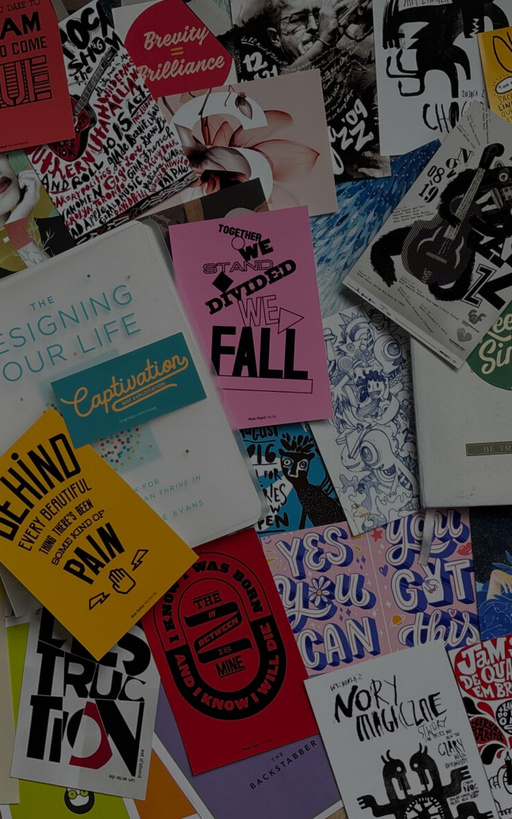 A colorful collage of some of Sonia's favorite posters with typography, illustrations, and motivational quotes arranged on a surface