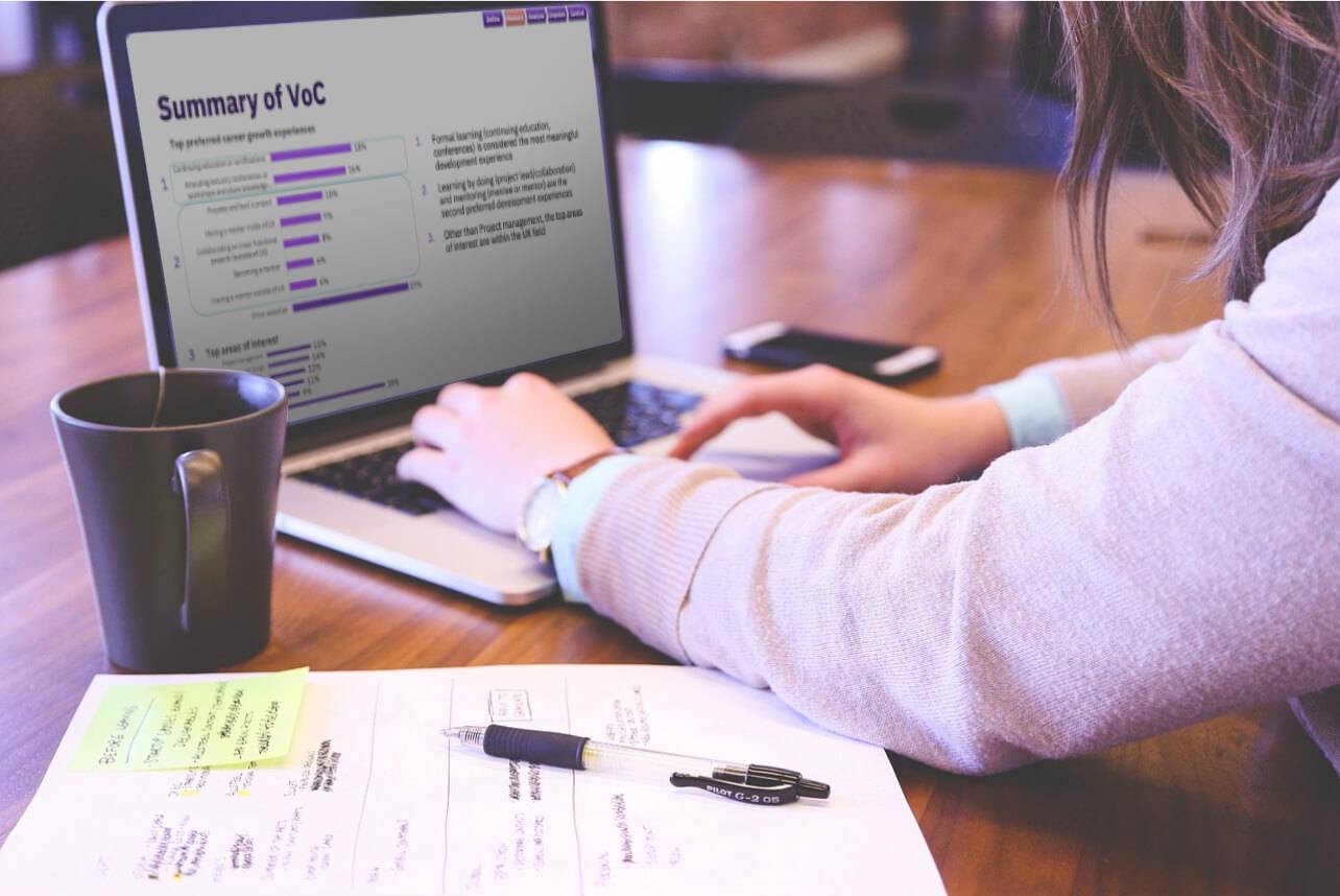 A woman reviewing a summary of customer feedback