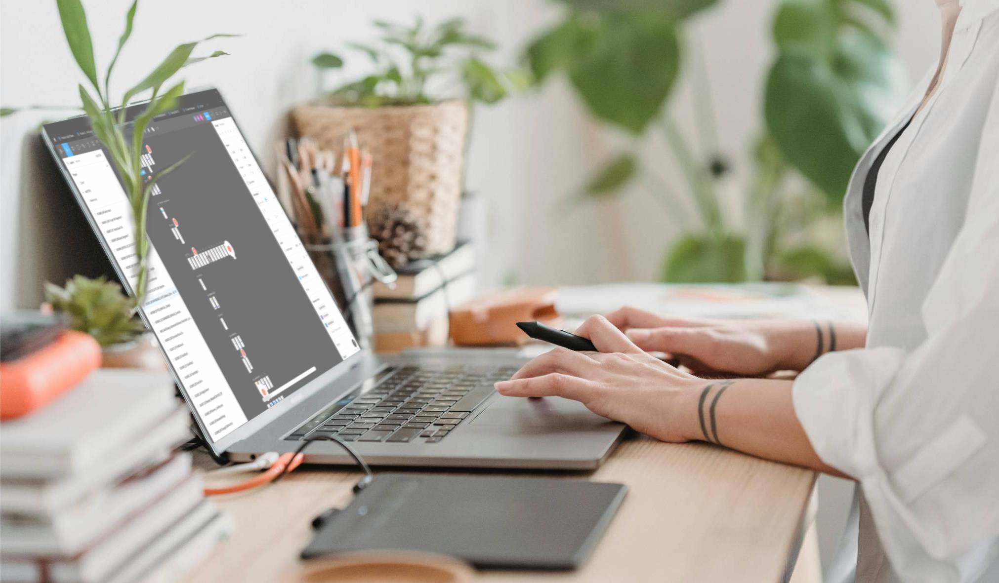 A woman focused on her laptop